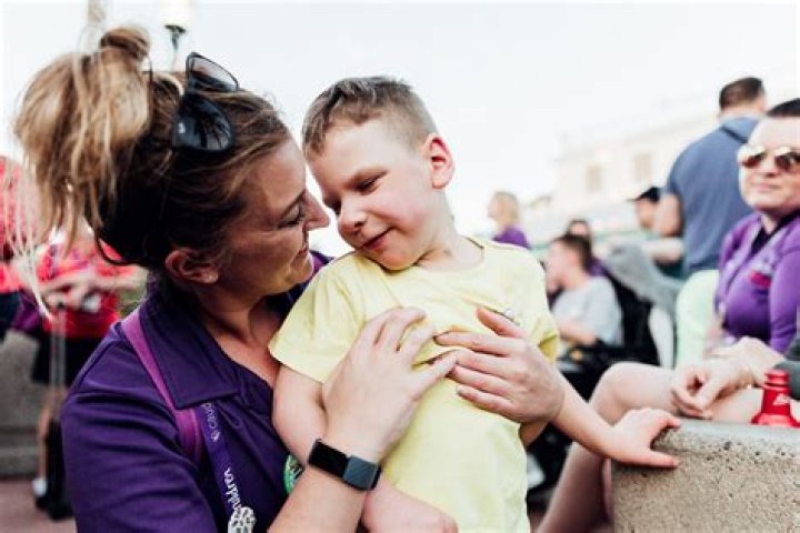 volunteer with two children