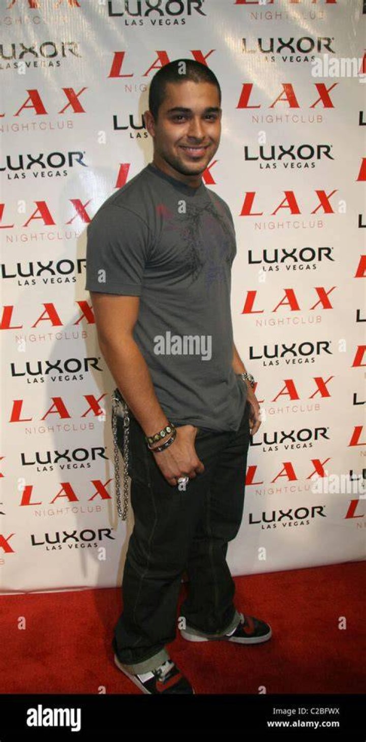 Wilmer Valderama posing in leather jacket