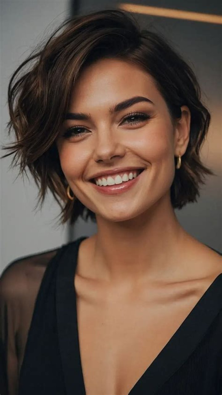woman with short hair in high ponytail