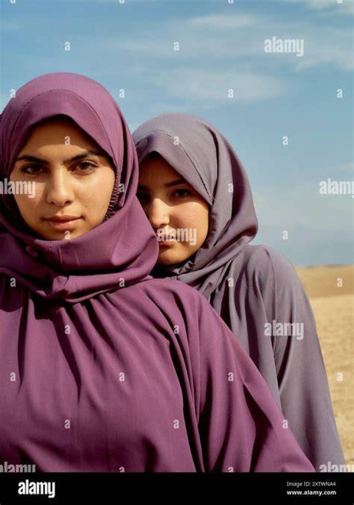 Women wearing hijabs in a computer lab
